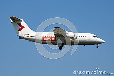 EasyJet British Aerospace Avro RJ100 D-AMGL passenger plane arrival and landing at Vienna Airport Editorial Stock Photo