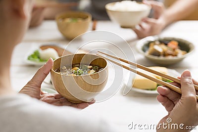 Eat miso soup with chopsticks Stock Photo