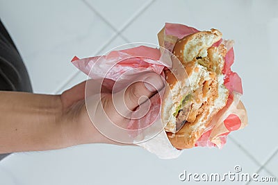 Eat lunch with big hamburger in hand .Food Stock Photo
