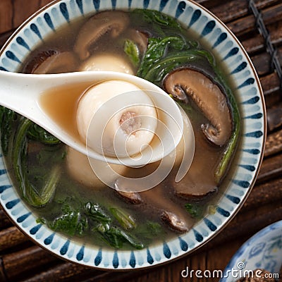 Eating big tangyuan yuanxiao with savory soup in Taiwan Stock Photo