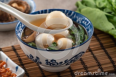 Eating big tangyuan yuanxiao with savory soup in Taiwan Stock Photo