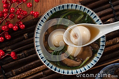 Eating big tangyuan yuanxiao with savory soup in Taiwan Stock Photo