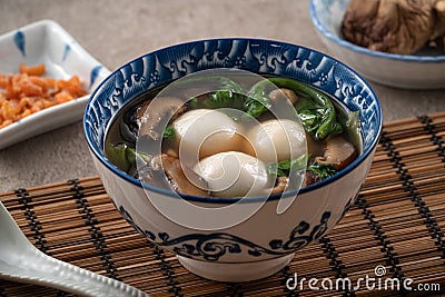 Eating big tangyuan yuanxiao with savory soup in Taiwan Stock Photo