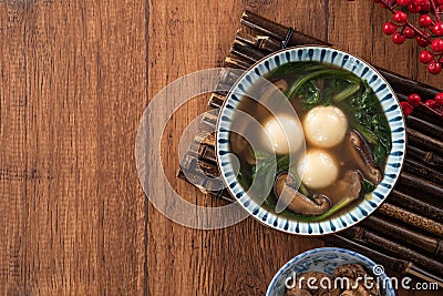 Eating big tangyuan yuanxiao with savory soup in Taiwan Stock Photo