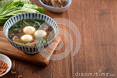 Eating big tangyuan yuanxiao with savory soup in Taiwan Stock Photo