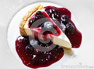 Eating blue berry cheese cake Stock Photo