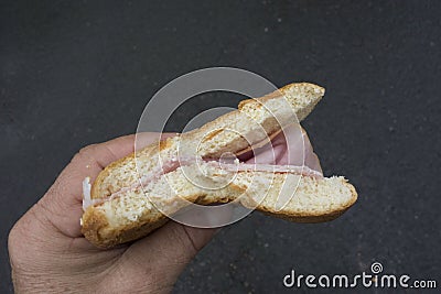 Eating a bologna or baloney sandwich Stock Photo
