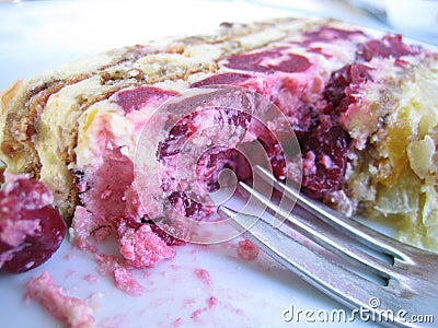 Eating a cherry cake Stock Photo