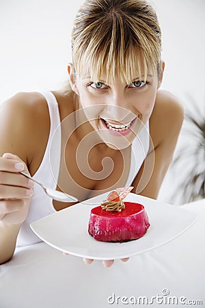 Eating cherry cake Stock Photo