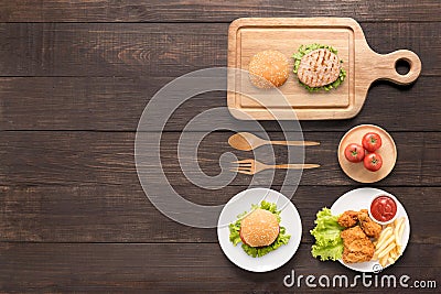 Eating concept Burgers, fried chicken,french fries and tomato on Stock Photo