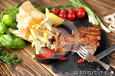 Eating of delicious grilled ribs Stock Photo