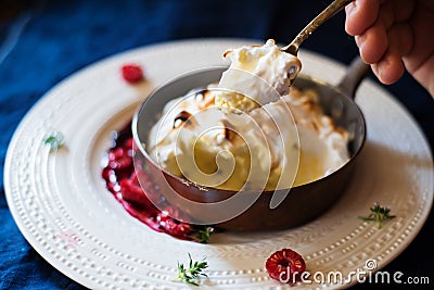 Eating home made Baked aAlaska Stock Photo