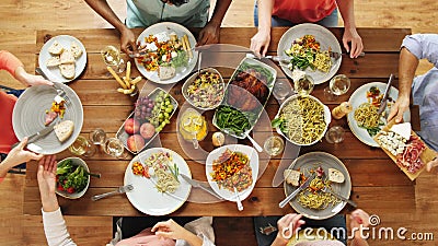 Group of people eating at table with food. Eating and leisure concept - group of people having dinner at table with food stock video footage Group of people eating at table with food. Eating and leisure concept - group of people having dinner at table with food stock video footage