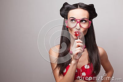 Eating lollipop Stock Photo