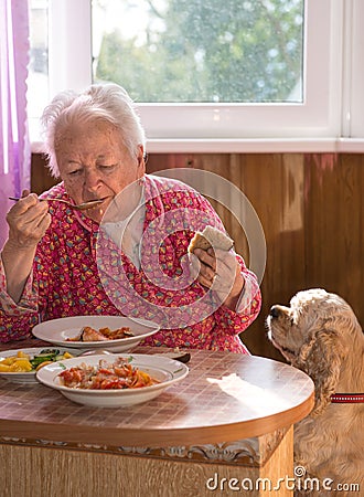 Eating old woman Stock Photo