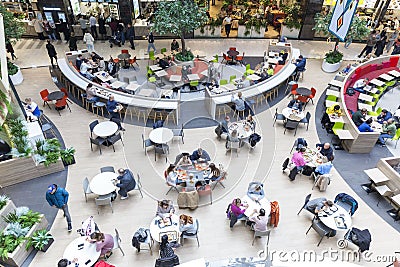 Eating people at tables at the food court in the mall. Top view. Russia, Moscow, 2022-10-07 Editorial Stock Photo