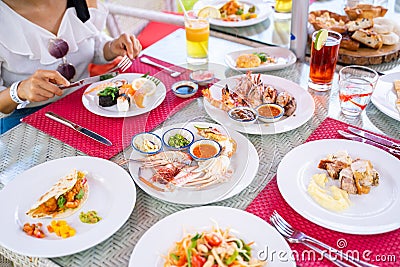 Eating seafood and meat in sunday brunch Stock Photo