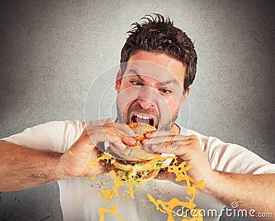 Eating with violent impetuosity Stock Photo