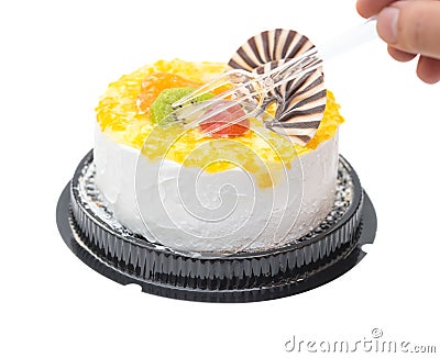 Eating a yummy cake with grape orange kiwifruit and chocolate with clipping path Stock Photo