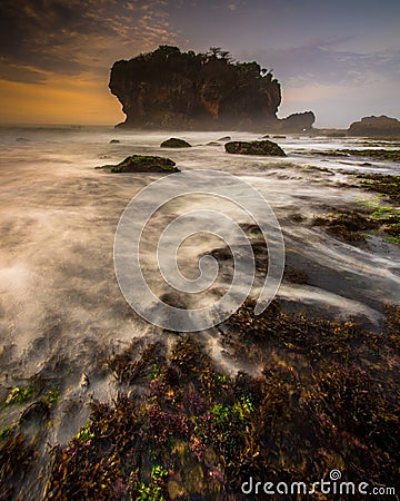 the ebb and flow of the morning waves blanketed the beach lagoon Stock Photo