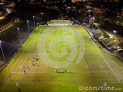 EBBW VALE, WALES - FEBRUARY 03 2023: Night time aerial view of the floodlit main Rugby union ground in the Welsh valleys town of Editorial Stock Photo