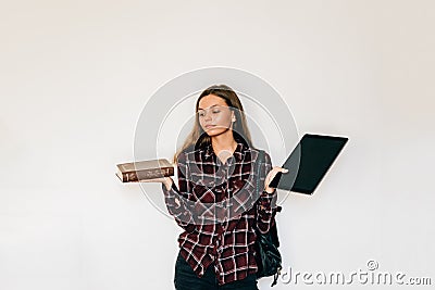 Ebooks with book old with new paper book with electronic tablet student holding in her hands copy space Stock Photo