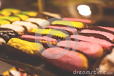 The Eclair in the bakery window. Stock Photo