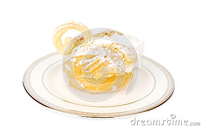 Eclair swan dessert on he plate. Stock Photo