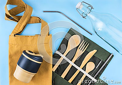 Eco bags with bamboo cutlery, reusable coffee mug and water bottle. Stock Photo