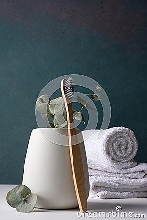 Eco-friendly bamboo toothbrushes in a white holder Stock Photo