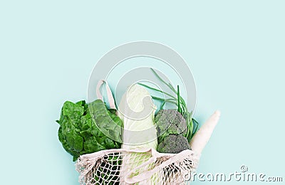 Eco-friendly beige shopping bag with grapes on a white background. String bag with fruits. Zero waste, no plastic concept Stock Photo