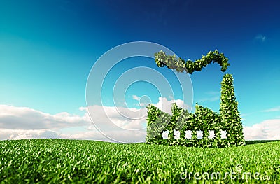 Eco friendly industry concept. 3d rendering of green factory icon on fresh spring meadow with blue sky in background. Stock Photo