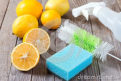 Eco-friendly natural cleaners baking soda, lemon and cloth on wooden table Stock Photo
