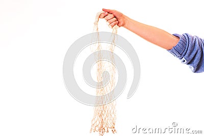Eco friendly string bag in the hand on white background, responsible consumption. Ecological concept Stock Photo