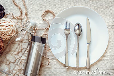 Eco Living and Packaging Reusable Products Concept, Empty Containers and Household on The Table With Fork, Spoon, Knife, Dish, Bag Stock Photo