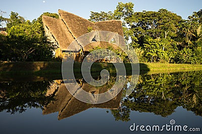 Eco lodge reflecting in water in Ecuador Editorial Stock Photo