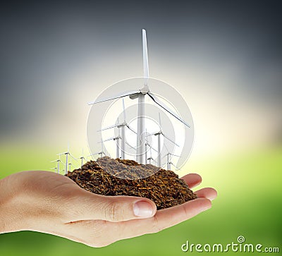 Eco power, wind turbines in hand Stock Photo