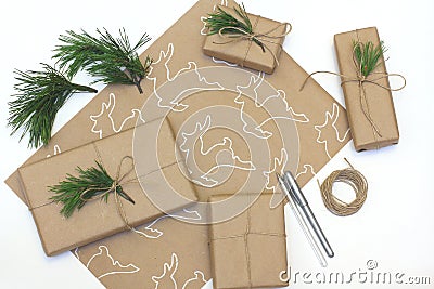 Eco style gift wrapping. Kraft paper with a picture of a deer painted white liner Stock Photo