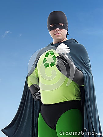 Eco superhero and CFL bulb Stock Photo