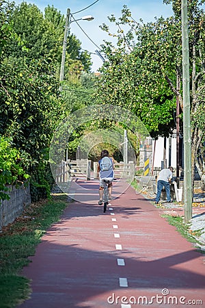 Eco view pedestrian / cycle lane, with cyclist pedaling Editorial Stock Photo