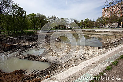 Ecological catastrophy. Drying lake in city park. Dry swamp lake disappears, idea and concept of environmental conservation, Stock Photo