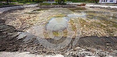 Ecological catastrophy. Drying lake in city park. Dry swamp lake disappears, idea and concept of environmental conservation, Stock Photo