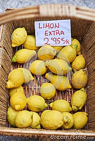 Ecological lemons in a wicker basket. Stock Photo