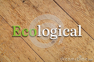 `Ecological` text on a wooden background. Stock Photo