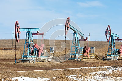 ecology, bionomics. Oil pumps. Oil industry equipment. Beam Pump Stock Photo