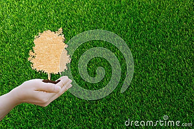 Ecology concept paper cut human hands holding big plant tree with on world environment Stock Photo