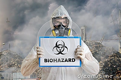 Ecology and pollution concept. Man in coveralls is warning against biohazard waste Stock Photo