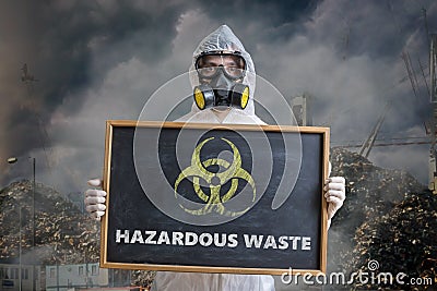 Ecology and pollution concept. Man in coveralls is warning against hazardous waste Stock Photo