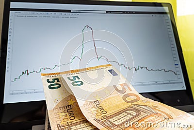 Economic crisis. euro revaluation and devaluation. graph of sharp rise and fall of euro exchange rate on screen of a laptop. Stock Photo
