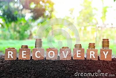 Economic recovery, economy bounce back, regain, rebound, pick up and business comeback concept. Wooden blocks with downward. Stock Photo